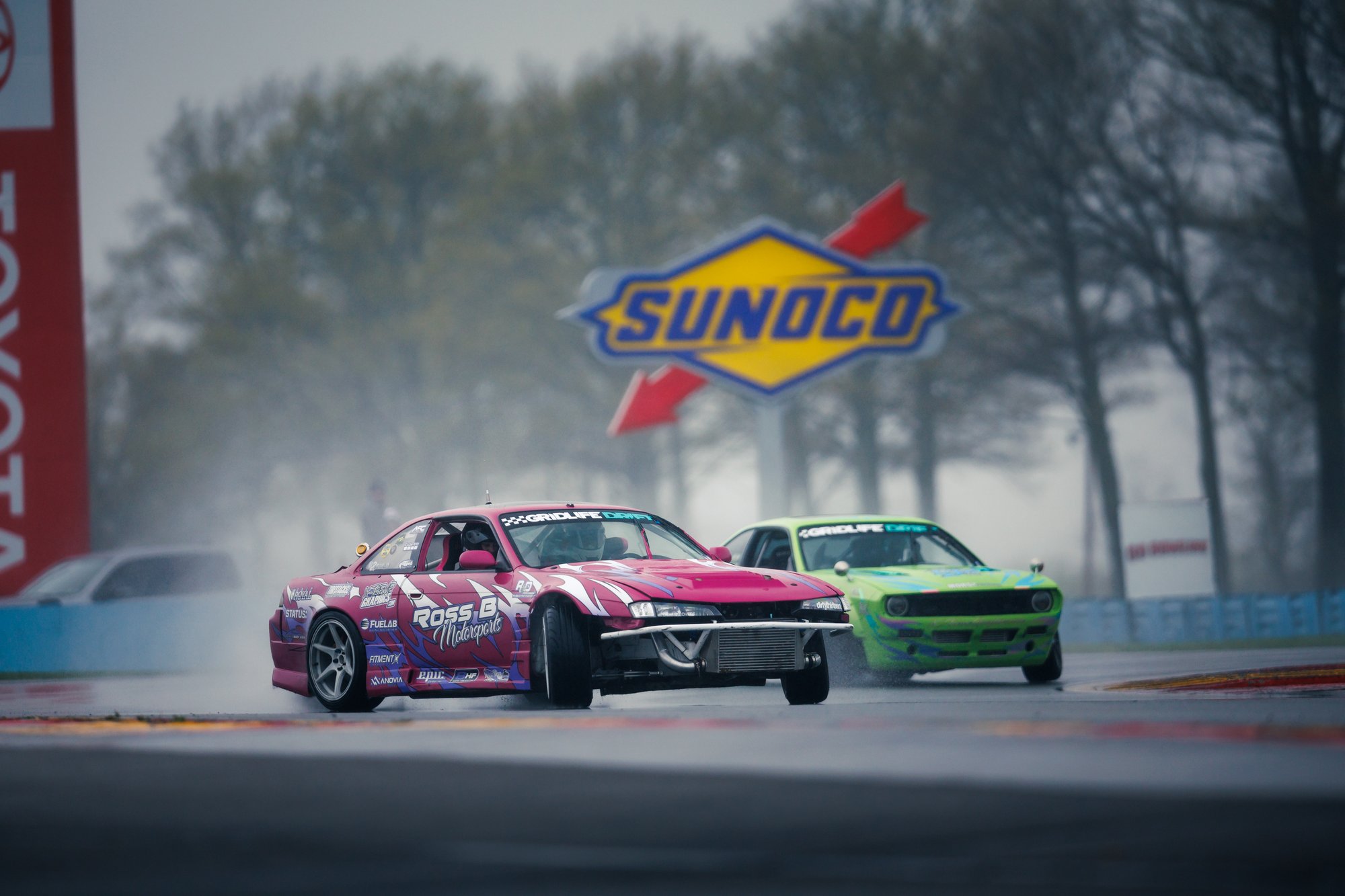 Race Cars with Sunoco Sign in Background
