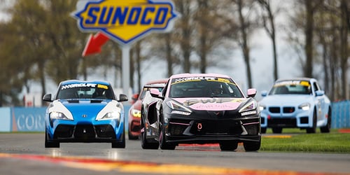 Race Cars with Sunoco Signage in Background